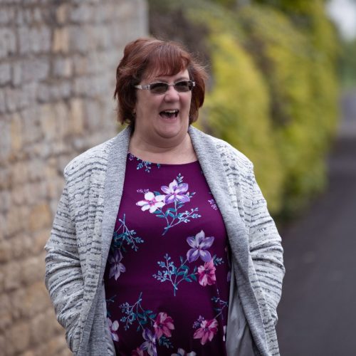 Nicola , The People Mentpr standing outside